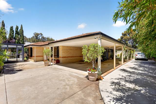 Front of the house and wide driveway