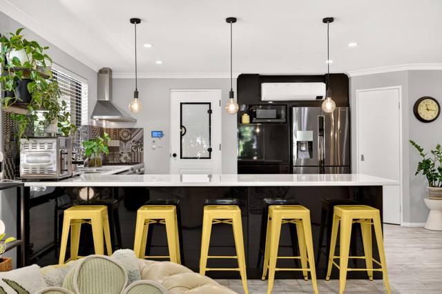 Kitchen island breakfast bar with yellow stools